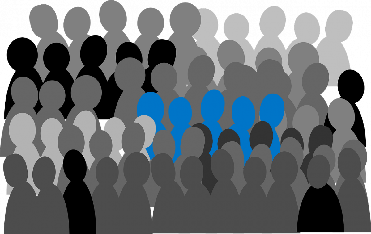 Vector image of several blue people standing out from the crowd of grey ones